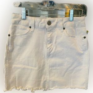 Mudd flex stretch, size 3, white mini skirt with fraying at the bottom.